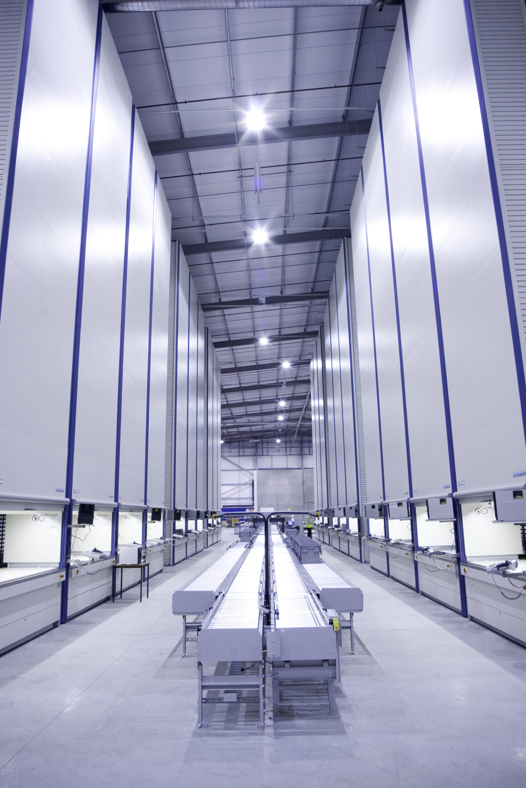 Automated Storage and Retrieval Systems with Conveyor.